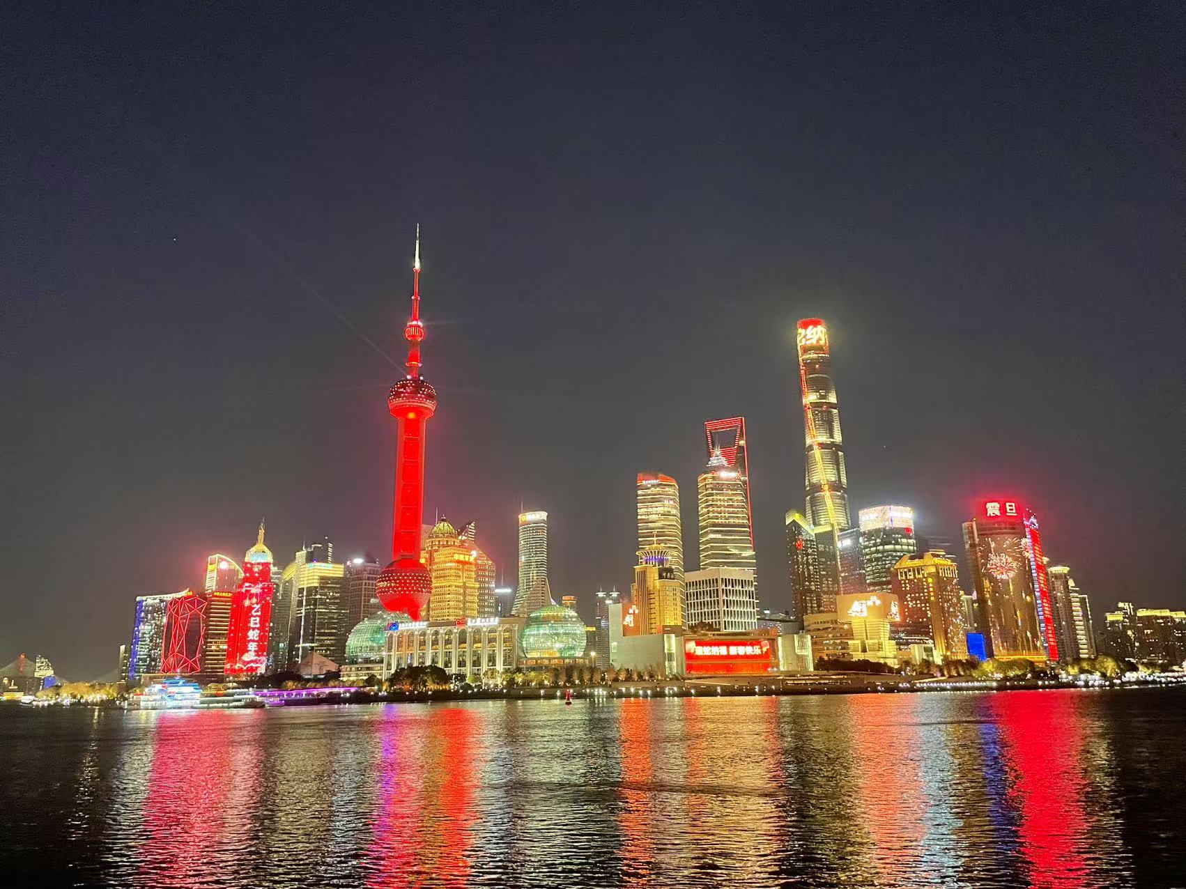 Oriental Pearl and Shanghai Tower, together with towers around the world, light up in red in celebration of the Spring Festival of the Year of the Snake